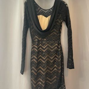 Gorgeous fitted mini dress with low-swag back